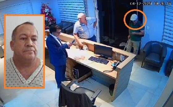 O atirador Antonio Gomes (circulado em laranja), durante visita ao escritório do advogado Roberto Zampieri (ao centro), um dia antes do crime.